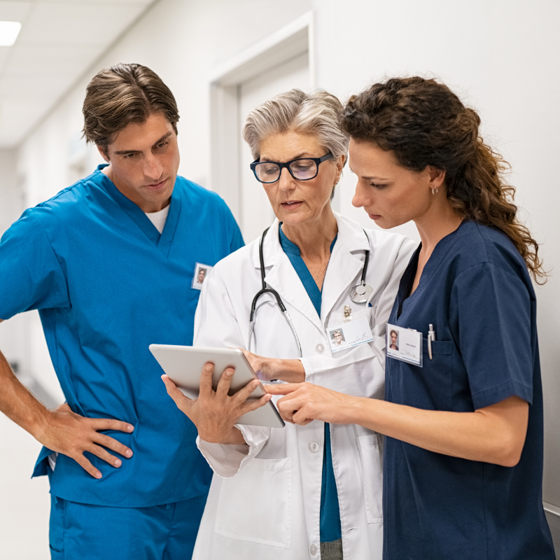 Group of healthcare professionals looking at tablet